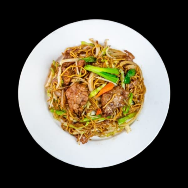 China Wok's beef chow mein with noodles, beef, and mixed vegetables on a white plate.