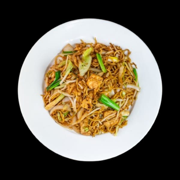 A white plate filled with China Wok's chicken lo mein, featuring noodles, chicken, and vegetables.
