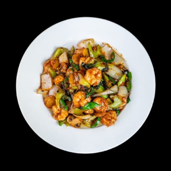 China Wok's spicy shrimp stir-fry with green peppers, onions, and mushrooms on a white plate.
